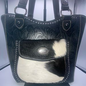 Trinity Ranch, cowhide fur on western tooled leather, concealed carry purse.